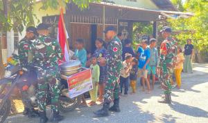 Satgas Yonif 741/GN Gandeng Mahasiswa KKN Bagi Bubur Kacang Untuk Warga Silawan